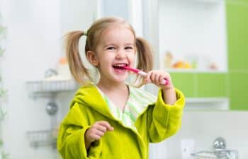 girl brushing her teeth