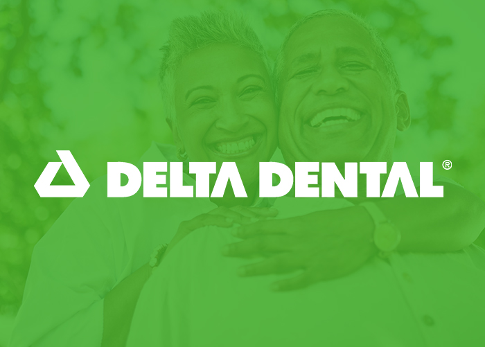 Delta Dental logo with white text on green background featuring smiling people.