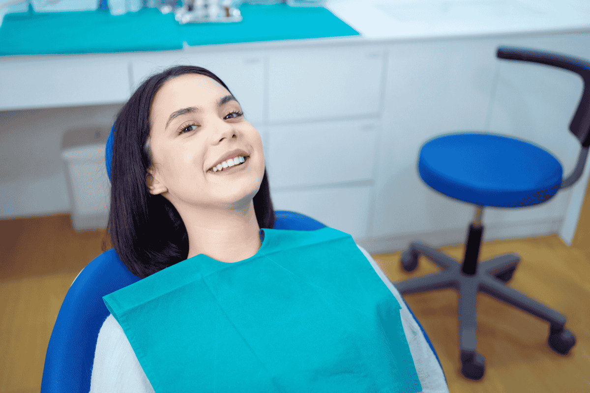 Happy Women Smiling Brightly Siting at Dental Office