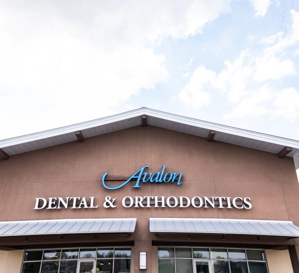 Avalon Dental & Orthodontics storefront exterior with signage and entrance during daytime.